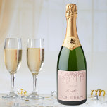 50th birthday blush rose gold glitter drips name sparkling wine label<br><div class="desc">A sparkling wine bottle label for a girly and glamourous 50th birthday party with the girls. A faux rose gold metallic looking background with an elegant faux rose gold glitter drips, paint drip look. The text: The name is written in dark rose gold with a large modern hand lettered style...</div>