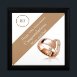 50th Wedding Anniversary Gift Box<br><div class="desc">This lovely Anniversary gift box is perfect for a couples 50th Wedding Anniversary. The suggested theme for this anniversary is gold. With this in mind I have featured two gold wedding rings in the design with a banner and editable text so it can be made truly personal. Perfect to hold...</div>