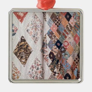 53:Detail of a patchwork quilt made by Mrs Metal Ornament