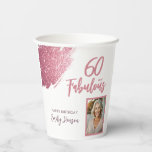 60 and Fabulous Pink Glitter Photo 60th Birthday Paper Cups<br><div class="desc">60 and Fabulous Pink Glitter Photo Surprise 60th Birthday Paper Cups. Stunning personalized cups with “60 and Fabulous” text and pink glitter design. Featuring sparkly faux-glitter brush strokes, and space for a personal photo, this elegant design is perfect for honouring a fabulous woman’s milestone birthday. Fully customizable to include a...</div>