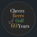 60th Birthday Cheers and Beers Golf Black and Gold Classic Round Sticker<br><div class="desc">This is a cool and modern, 60th birthday, golf party design. It is a simple, minimal design, in classic black and gold typography with pops of orange and green. Perfect for a cool and fun, golf and beer themed, 60th birthday party. This design is fully customizable, simply use the personalize...</div>