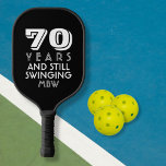 70 Years Still Swinging Custom Text Age Name Colou<br><div class="desc">The perfect pickleball paddle for someone who is still out there swinging - makes a great birthday, retirement, or anniversary gift. Design features bold typography that reads "70 and still swinging" Change the age to 50, 60, 80, etc. and the text to still playing, still pickling, etc. Also add the...</div>