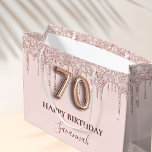 70th birthday blush pink glitter drips rose gold large gift bag<br><div class="desc">Elegant, classic, glamourous and girly for a 70th birthday party. A blush pink background. Decorated with rose gold, pink faux glitter drips, paint dripping look. Personalize and add a name. With the text: Happy Birthday. The name is written with a modern dark rose coloured hand lettered style script. Number 70...</div>