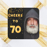 70th birthday cheers to 70 gold balloon text black square sticker<br><div class="desc">A trendy 70th birthday party sticker. With the text: Cheers to 70 on front written with faux gold balloon letters. Black background with golden confetti. Template for your photo.</div>