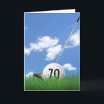 70th birthday golf ball in grass card<br><div class="desc">White golf ball in green grass with golf club and sky background for 70th birthday.
Age number on golf ball can be edited.</div>