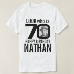 70th birthday mono look 70 custom photo and name T-Shirt<br><div class="desc">70th birthday mono, look who is 70 custom photo and name t-shirt. Fun 70th personalized photo black and white birthday tee design. Personalize this birthday shirt with a photograph of the birthday boy or girl in the middle of the number 0. Great idea for adding some fun to a milestone...</div>