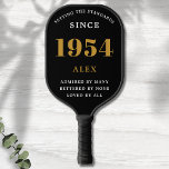 70th Birthday Name 1954 Black Gold Elegant Chic Pickleball Paddle<br><div class="desc">Chic '1954' 70th Birthday Black and Gold Personalized Pickleball Paddle - Elegant Design for Sports Enthusiasts. Celebrate a significant milestone in style with our chic '1954' 70th birthday black and gold pickleball paddle. Elegantly designed and fully personalized, this paddle blends birthday charm and utility in one. Ideal for anyone with...</div>