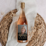 70th Birthday Party Photo Cheers Wine Label<br><div class="desc">This custom 70th birthday wine label features the guest of honour's personalized photo,  name,  and birthday,  along with the word "Cheers" in elegant gold-coloured calligraphy script. A dark screen helps make the text pop. A great way to celebrate someone who's turning seventy!</div>
