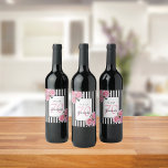 70th birthday pink florals on black white stripes wine label<br><div class="desc">A wine label for a 70th birthday party. Classic slim black and white vertical stripes as background. With girly and feminine pink roses as decoration. A white and black frame on front with template for age, name and date. Age number 70 in pink, name and date in black. The name...</div>