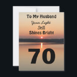 70th Husband Birthday Your Light Shines Sunset<br><div class="desc">Give a happy 70th birthday card to your husband to express your “You Still Shine Bright” sentiment. A bold design with a black and gold sunrise on a peaceful lake sends a message of encouragement and love. Turn over the card to read the endearing birthday verse of light and happiness...</div>