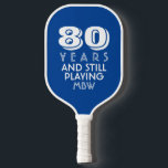 80 Years Still Playing Custom Age Name Text Colour Pickleball Paddle<br><div class="desc">The perfect pickleball paddle for someone who is still out there playing - makes a great birthday, retirement, or anniversary gift. Design features bold typography that reads "80 and still playing" Change the age to 50, 60, 70, etc. and the text to still swinging, still pickling, etc. Also add the...</div>