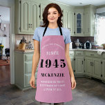 80th Birthday 1945 Name Chic Elegant Pink Apron<br><div class="desc">Elegant pink chic apron - 80th Birthday 1945 Name Personalized Kitchen & BBQ Essentials. Celebrate a fabulous birthday with style and practicality! This elegant chic apron is the perfect accessory for the culinary enthusiast in your life. Its eye-catching design, enhanced with a touch of class, adds a charming vibe to...</div>