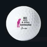 80th Birthday Funny Women Golfer Still Swinging Golf Balls<br><div class="desc">Celebrate her 80th birthday in style with this funny and personalized golf ball designed just for women. Featuring the phrase “80 Years & Still Swinging” with a pink golfer silhouette, it’s a playful way to honour her love for the game. Add her name for a personal touch and create a...</div>