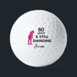 80th Birthday Funny Women Golfer Still Swinging Golf Balls<br><div class="desc">Celebrate her 80th birthday in style with this funny and personalized golf ball designed just for women. Featuring the phrase “80 Years & Still Swinging” with a pink golfer silhouette, it’s a playful way to honour her love for the game. Add her name for a personal touch and create a...</div>