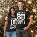 80th birthday mono look 80 custom photo and name T-Shirt<br><div class="desc">80th birthday mono, white out, look who is 80 custom photo and name t-shirt. Fun 80th personalized photo white birthday tee design. Personalize this birthday shirt with a photograph of the birthday boy or girl in the middle of the number 0. Great idea for adding some fun to a milestone...</div>