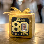 80th birthday photo black and gold effortless square sticker<br><div class="desc">Eightieth birthday photo making 80 look effortless modern simple elegant gold on black sticker. Great idea for adding some stylish simple fun to a 80th birthday party. Personalize with your own photo in the 0 of 80. Great for favours and party decor. Other matching items are available. Unique graphics by...</div>