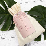 80th Birthday rose gold glitter drips thank you Gift Tags<br><div class="desc">A girly and trendy favor tag for 80th birthday party. A feminine pink, rose gold faux metallic looking background decorated with faux rose gold glitter drips. Dark rose gold colored letters. On front: The text: Thank You is written with a large trendy hand lettered style script. Back: The text: Thank...</div>