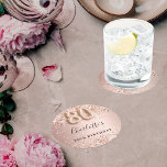 80th birthday rose gold name round paper coaster<br><div class="desc">Elegant,  classic,  glamourous for a 80th birthday party.  Rose gold and blush gradient background. Decorated with rose gold confetti.  Personalize and add a name.   The name is written with a modern dark rose coloured hand lettered style script.   Number 80 is written with a balloon style font.</div>