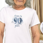 90th Birthday Cheers to 90 Years Floral Number T-Shirt<br><div class="desc">90th birthday t-shirt, which reads cheers to 90 years or you are welcome to edit the wording to personalize as you wish. Design features number 90 decorated with rose buds, flower blooms and foliage in shades of coastal blue and sand. Subtle feminine and elegant design with watercolor floral arrangements, paint...</div>