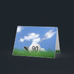 90th birthday golf ball in grass card<br><div class="desc">White golf ball in green grass with golf club and sky background for 90th birthday.</div>
