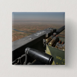 A 50 calibre machine gun 2 inch square button
