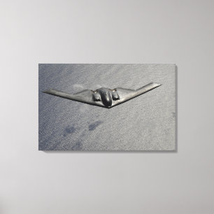 A B-2 Spirit flies over the Pacific Ocean Canvas Print