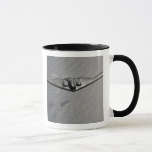 A B-2 Spirit flies over the Pacific Ocean Mug