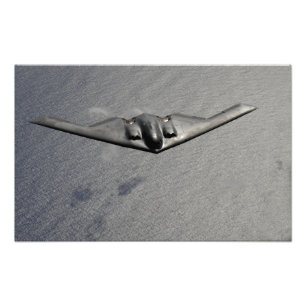 A B-2 Spirit flies over the Pacific Ocean Photo Print