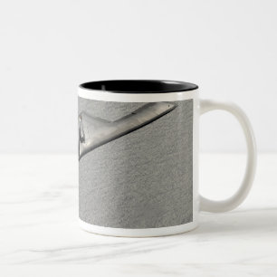 A B-2 Spirit flies over the Pacific Ocean Two-Tone Coffee Mug
