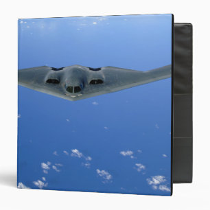 A B-2 Spirit soars through the sky Binder