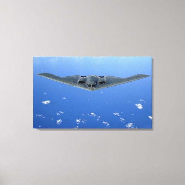 A B-2 Spirit soars through the sky Canvas Print (Front)