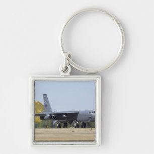 A B-52 Stratofortress deploys its drag chute Keychain
