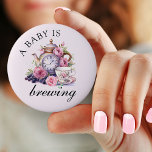 A Baby is Brewing Vintage Teapot and Tea Cups Pink 2 Inch Round Button<br><div class="desc">A baby is brewing button with vintage tea party design including teapot,  tea cups and pink roses. For co-ordinating invitations,  stationery,  games and day-of-event decor,  please browse my Vintage Tea Party Baby Shower Collection or message me to add any additional items you need.</div>