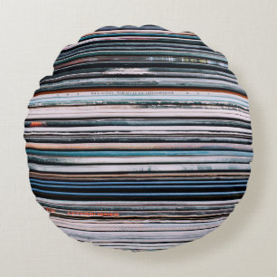 A background consisting of a stack of records in t round pillow