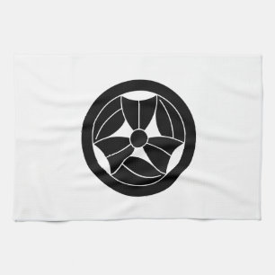 a bamboo leaf that is broken three times in a circ kitchen towel