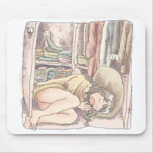 a bare-footed woman lying in front of an open clos mouse pad