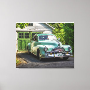 A beautiful, two-tone 1947 Pontiac Torpedo rests p Canvas Print