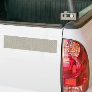 a beige background with a pattern of small squares bumper sticker