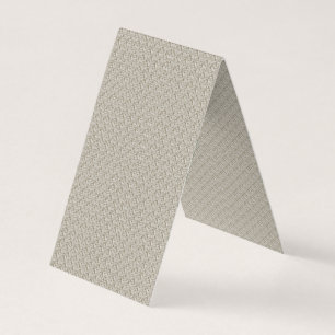 a beige background with a pattern of small squares business card