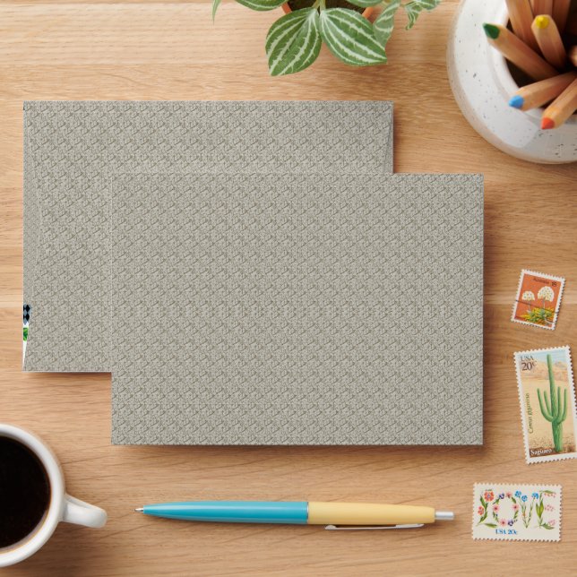 a beige background with a pattern of small squares envelope (Desk)