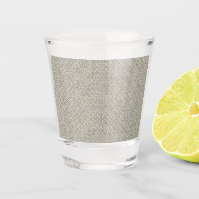 a beige background with a pattern of small squares shot glass (Front)