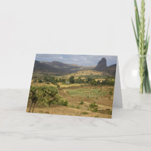 A big scenic view of a big rock mountain card