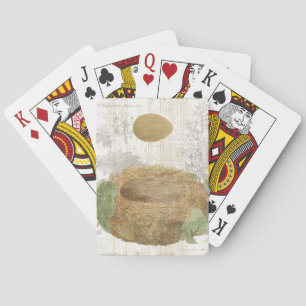 A Bird's Nest with a Brown Egg Playing Cards