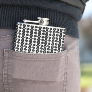 a black and white background with a lot of dots hip flask