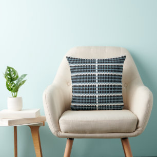 a black and white chequered pattern with a white b throw pillow