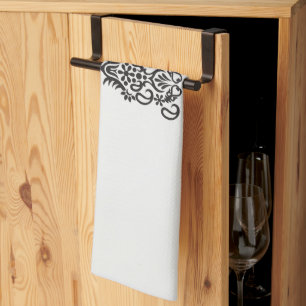 a black and white image of an ornate design kitchen towel