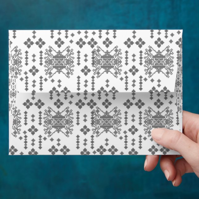 a black and white pattern with a white background envelope (Hand)
