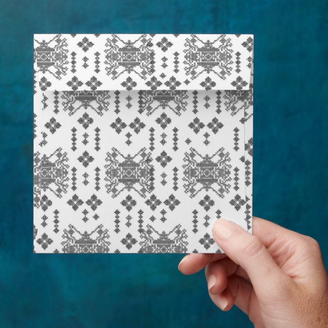 a black and white pattern with a white background envelope (Hand)