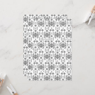 a black and white pattern with a white background invitation