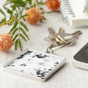 a black and white photo of a black and white photo keychain